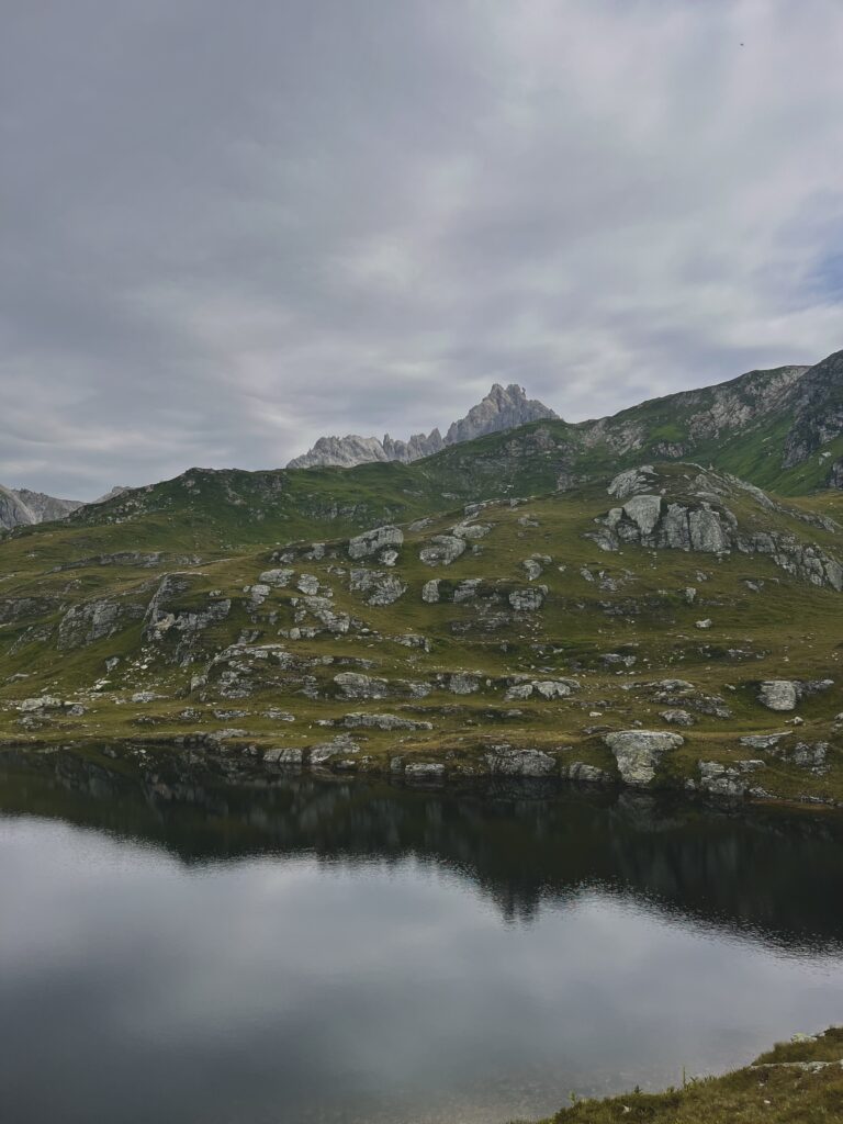 Dark lake, mountains in the background