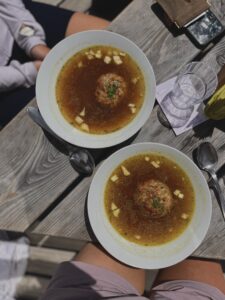 two bowls of soup with a dumpling
